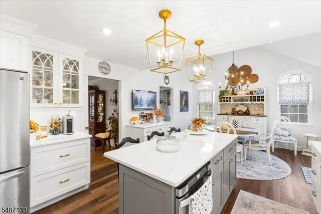 a kitchen with a dining table and chairs