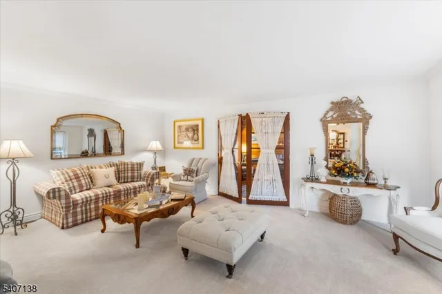 a living room with furniture and a gym machine