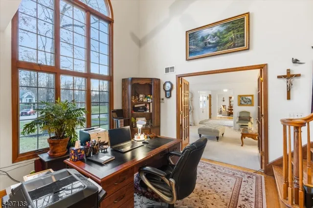 a workspace with furniture and a potted plant
