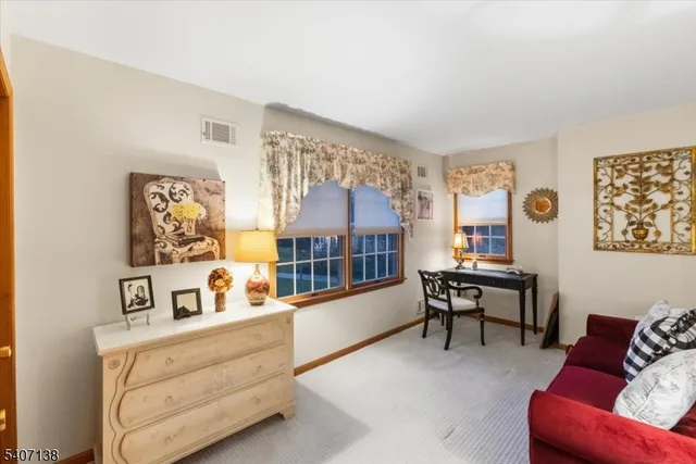 a bedroom with furniture and a window