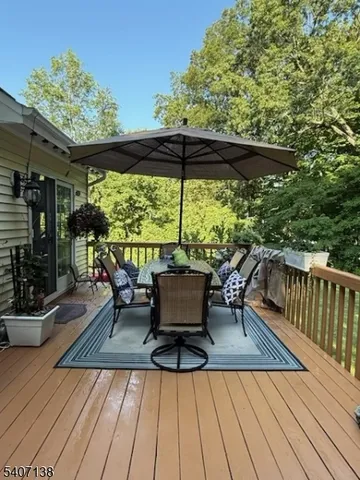 swimming pool view with a seating space