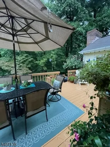 a view of a chairs and table in the patio