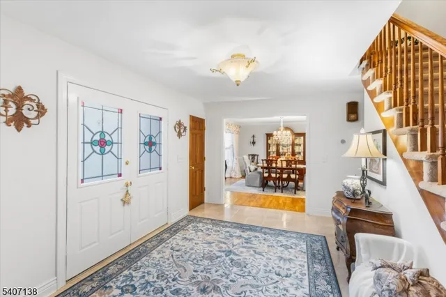 a view of a bedroom with a bed and a window