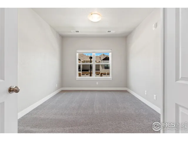 a view of a big room with windows and closet