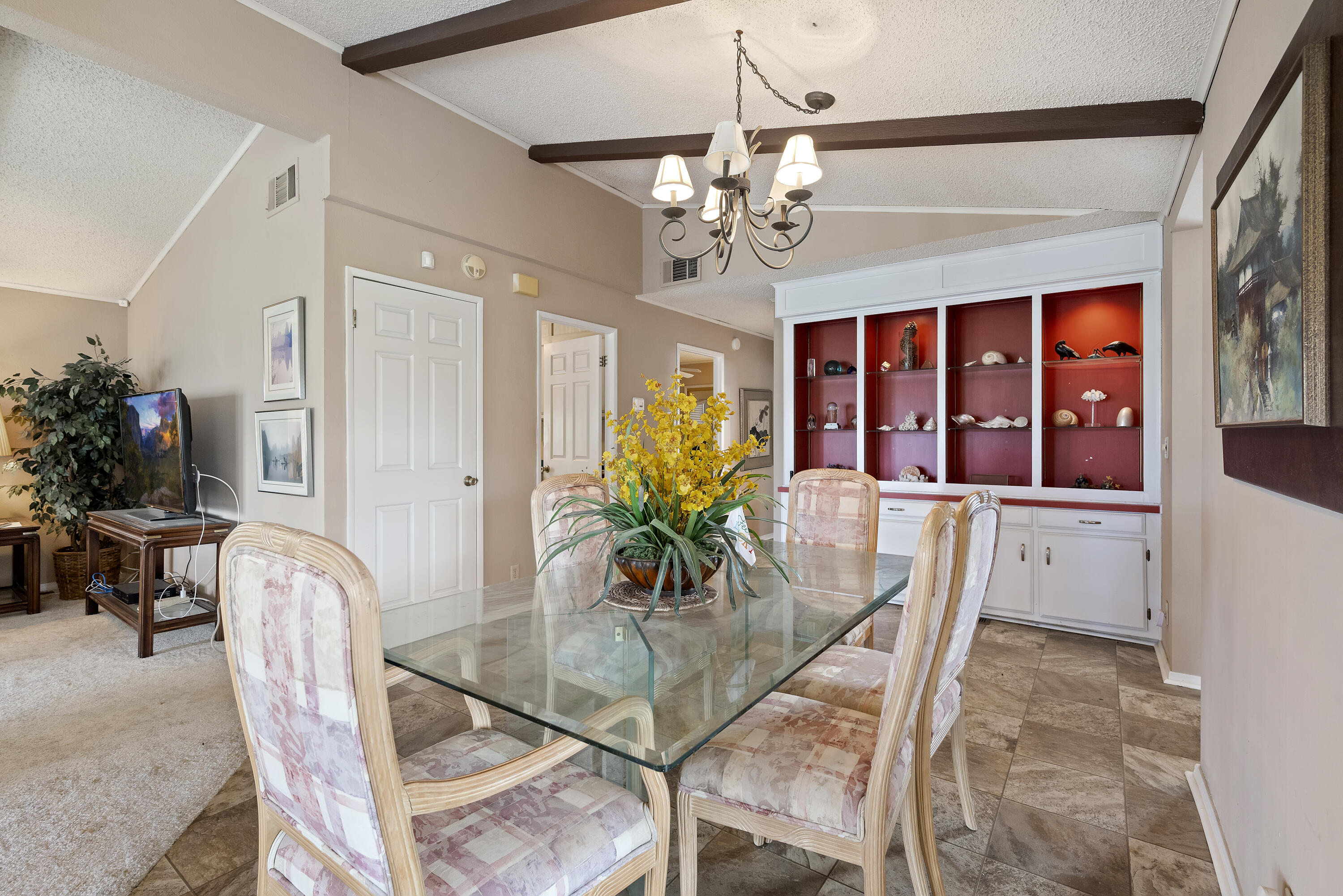 180 Orontes Way Cathedral City, CA 92234 - Photo 13 of 26 a dining room with furniture a livingroom and chandelier