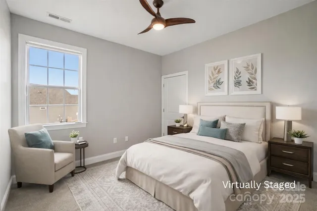 a bedroom with bed and window