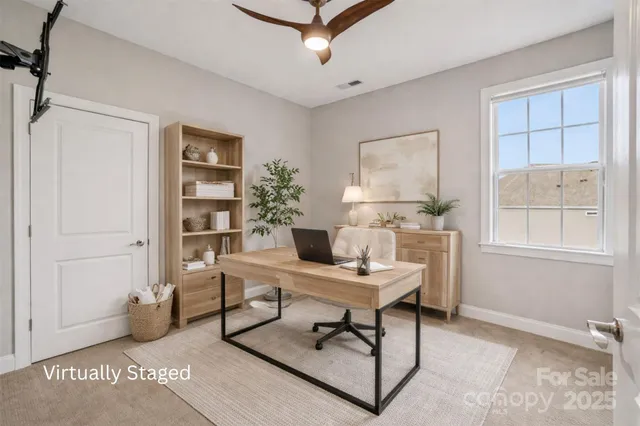 a workspace with furniture and window