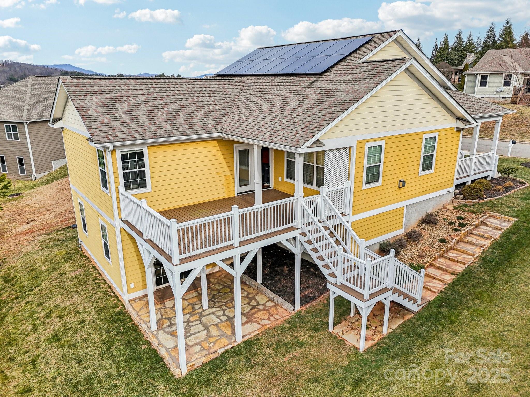 14 Rose Creek Road Leicester, NC 28748 - Photo 23 of 34 a view of a house with wooden deck and furniture