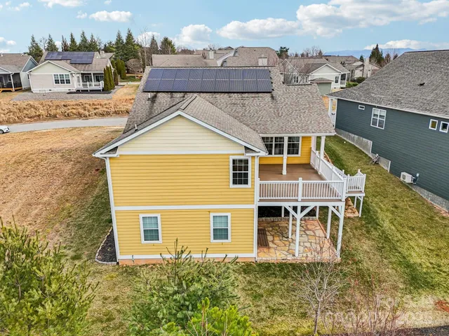 a aerial view of a house with a yard
