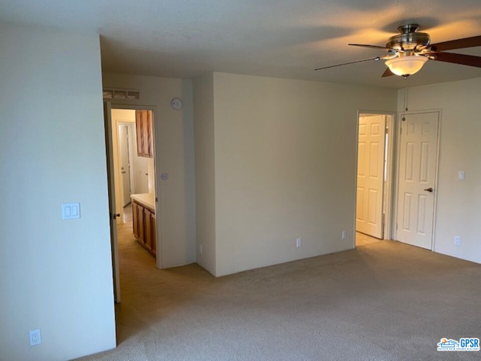 3522 Amber Lane Oceanside, CA 92056 - Photo 18 of 33 a view of a livingroom with a chandelier fan and windows