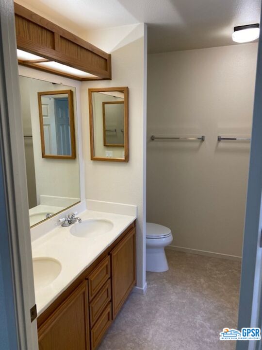 3522 Amber Lane Oceanside, CA 92056 - Photo 19 of 33 a bathroom with a sink a toilet and mirror