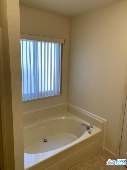3522 Amber Lane Oceanside, CA 92056 - Photo 20 of 33 a bath tub sitting in a bathroom next to a window