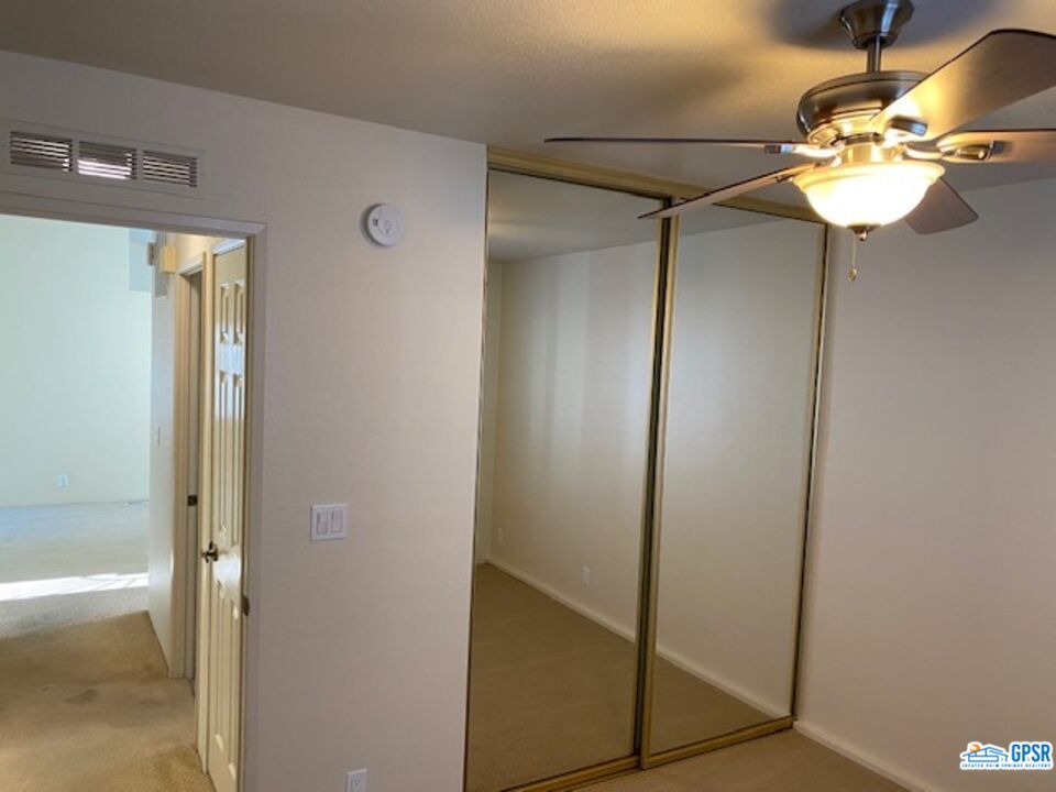 3522 Amber Lane Oceanside, CA 92056 - Photo 23 of 33 a view of a hallway with a glass door and chandelier fan