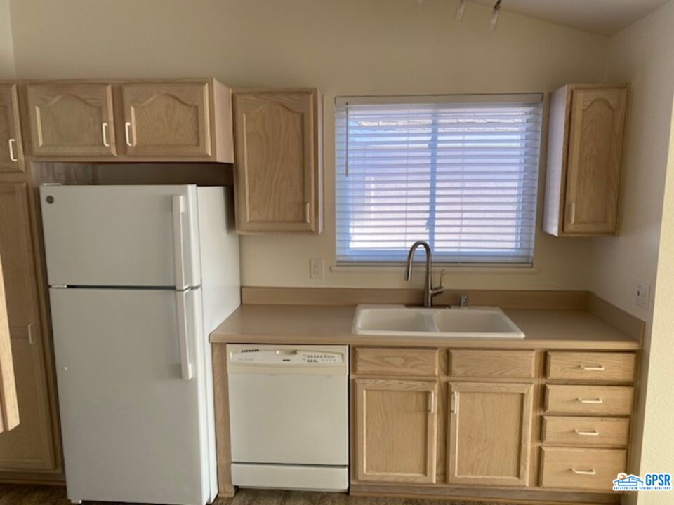 3522 Amber Lane Oceanside, CA 92056 - Photo 8 of 33 a white refrigerator freezer sitting inside of a kitchen