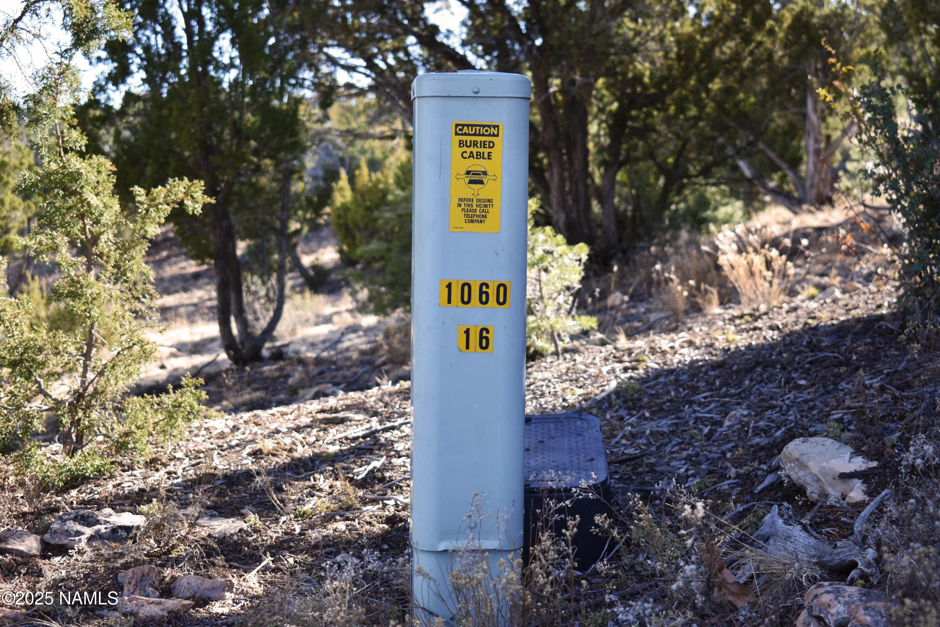 4367 Sunset Ridge Loop Happy Jack, AZ 86024 - Photo 17 of 17 a sign that is on a brick wall