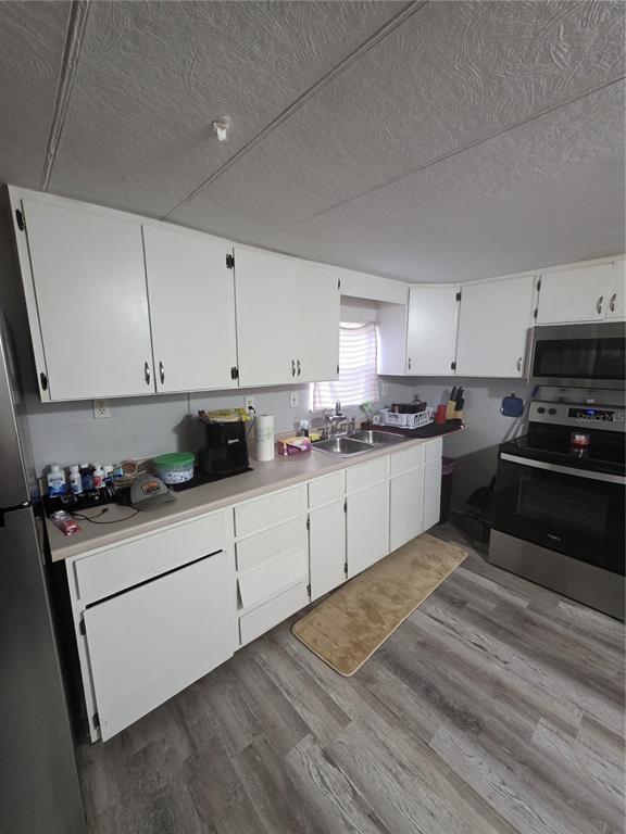 205 Little Star Road Hawthorne, FL 32640 - Photo 8 of 11 a kitchen with granite countertop white cabinets and white appliances