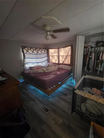 a room with furniture and a ceiling fan