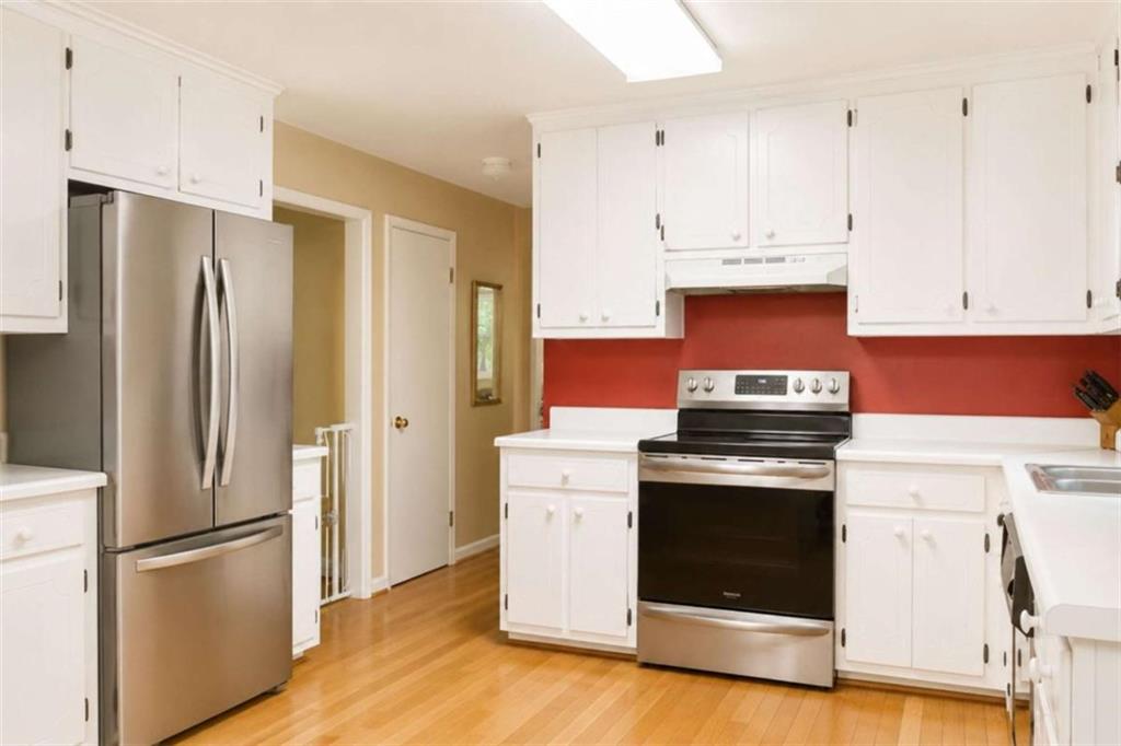 365 River Ridge Trail Oxford, GA 30054 - Photo 6 of 37 a kitchen with stainless steel appliances a stove a refrigerator and a cabinets