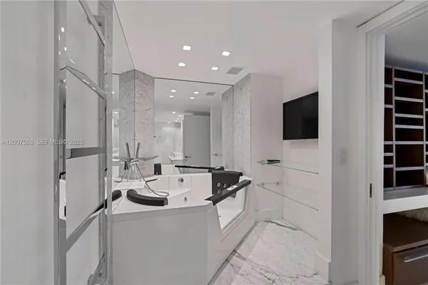 a room with pool table and flat screen tv