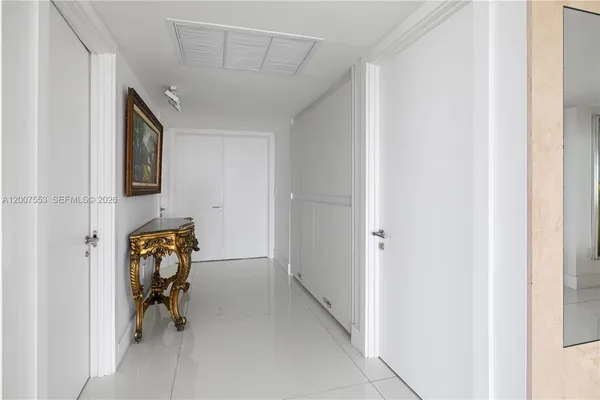 a view of a hallway to back door of the house