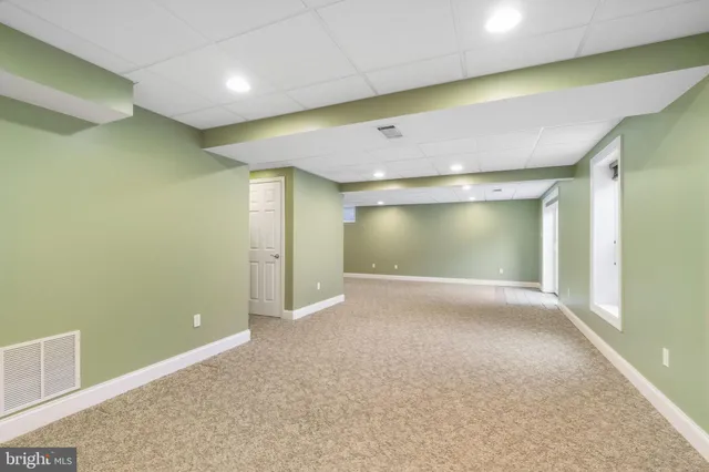 a bathroom with a toilet a sink and shower