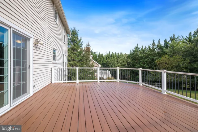 a view of balcony with deck and wooden floor