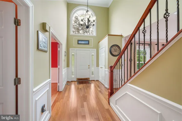 a view of front door with wooden floor