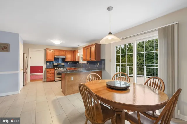 a dining room with furniture and window