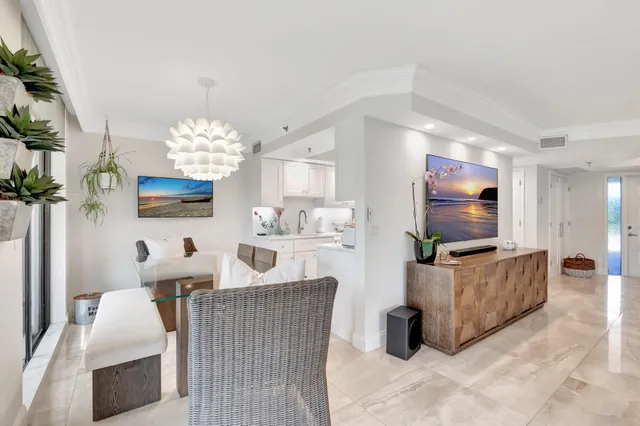 a white bath tub sitting next to a white sink