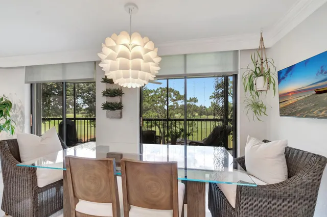 a bedroom with bed and a chandelier