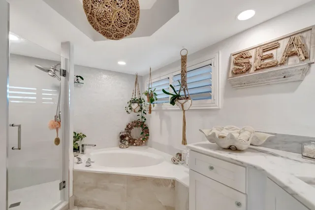 a view of a city from a balcony with furniture