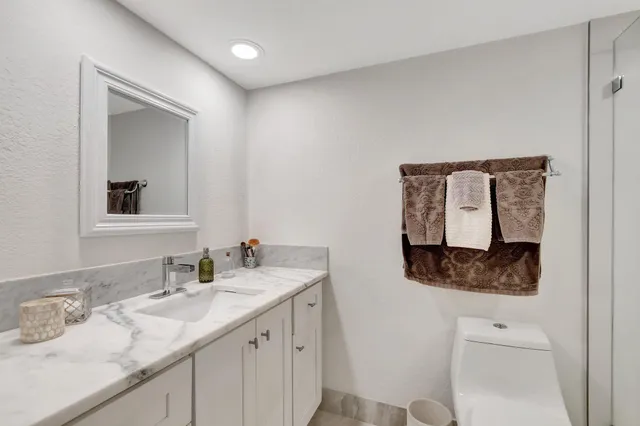 a view of a patio with a dining table and chairs
