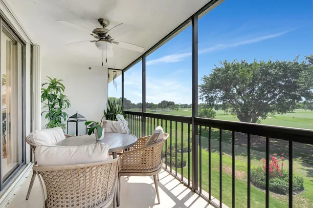 a bird view of multi story residential apartment building with yard