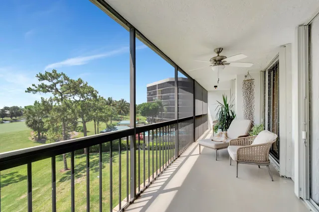 an aerial view of a city with lots of residential buildings and mountain view in back