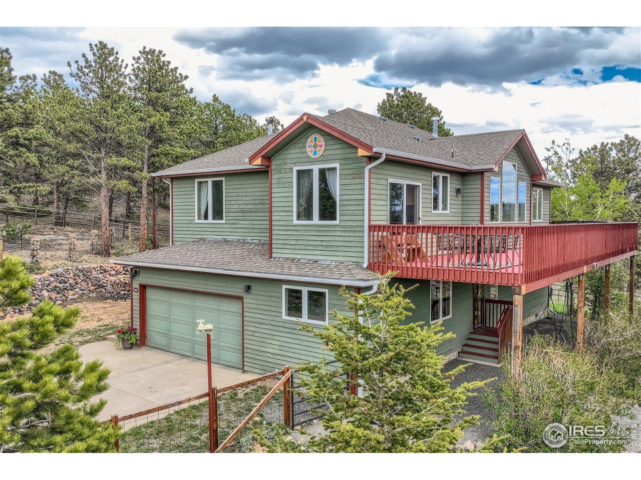 641 Ranch Road Ward, CO 80481 - Photo 1 of 40 a view of a house with a yard and potted plants
