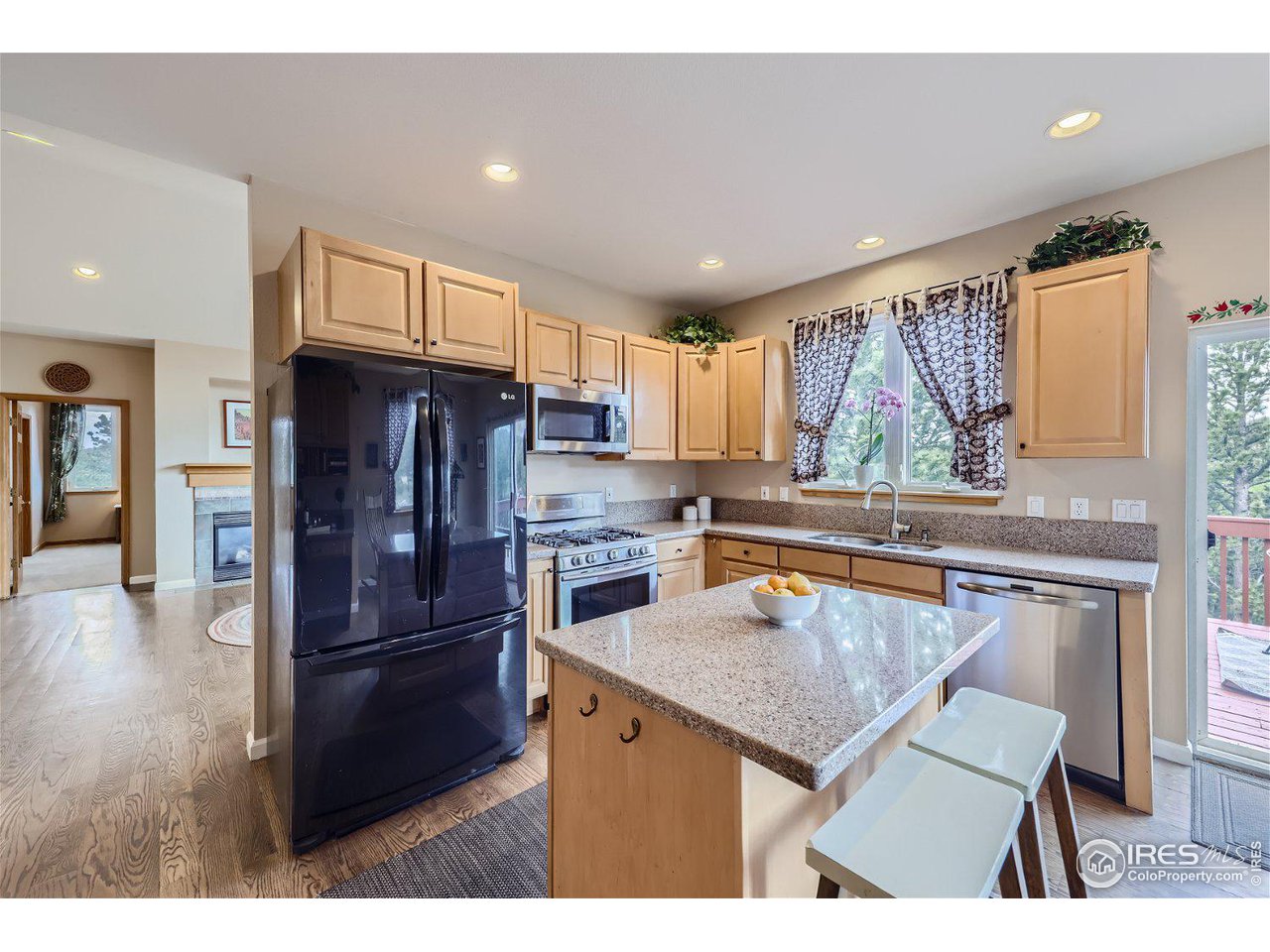 641 Ranch Road Ward, CO 80481 - Photo 11 of 40 a kitchen with a refrigerator a sink and a cabinets