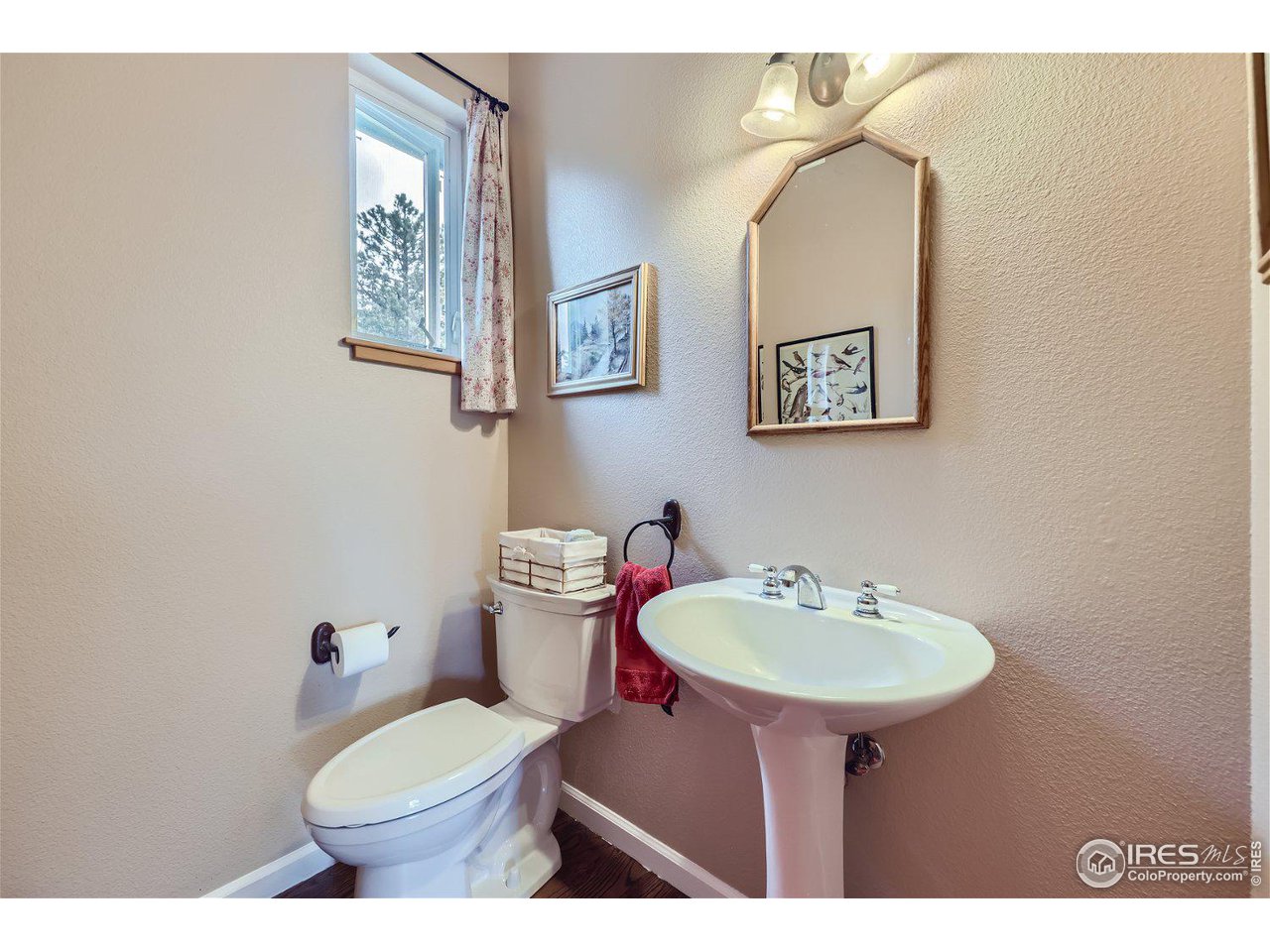641 Ranch Road Ward, CO 80481 - Photo 17 of 40 a bathroom with a sink mirror and toilet