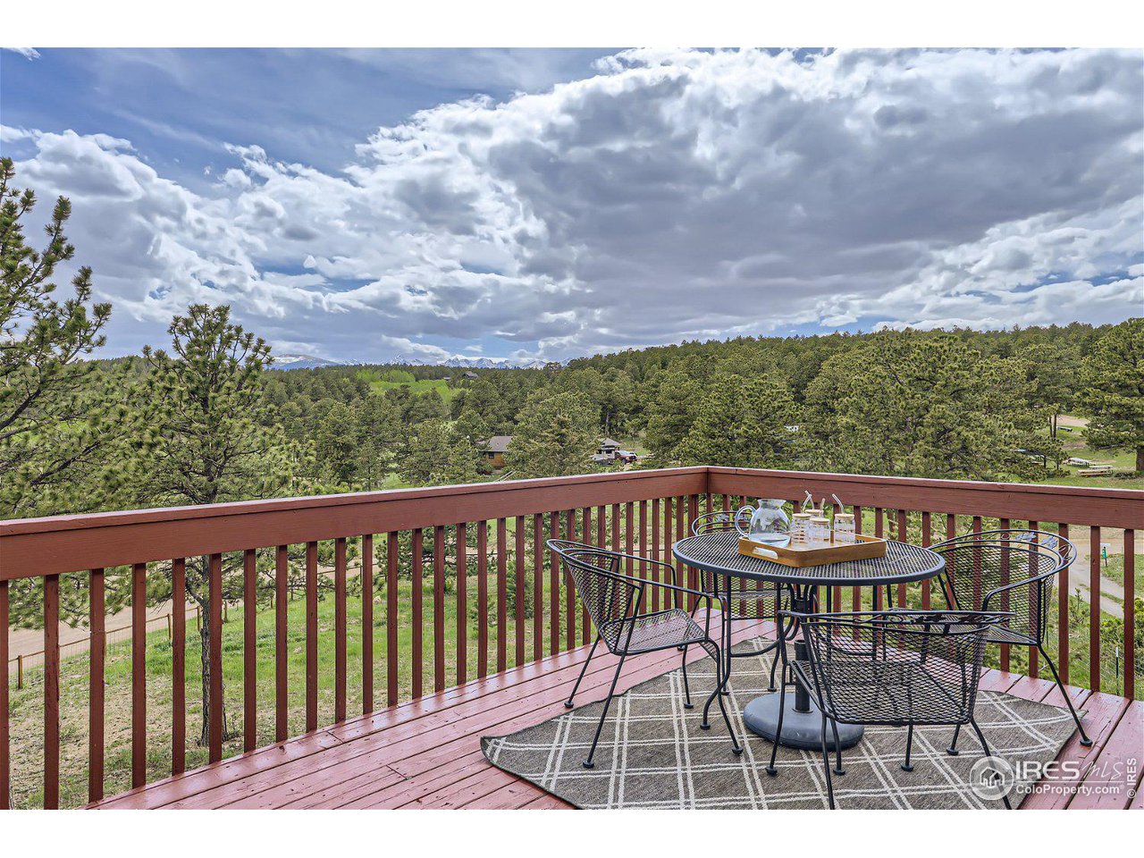 641 Ranch Road Ward, CO 80481 - Photo 24 of 40 a view of a chairs and table on the terrace