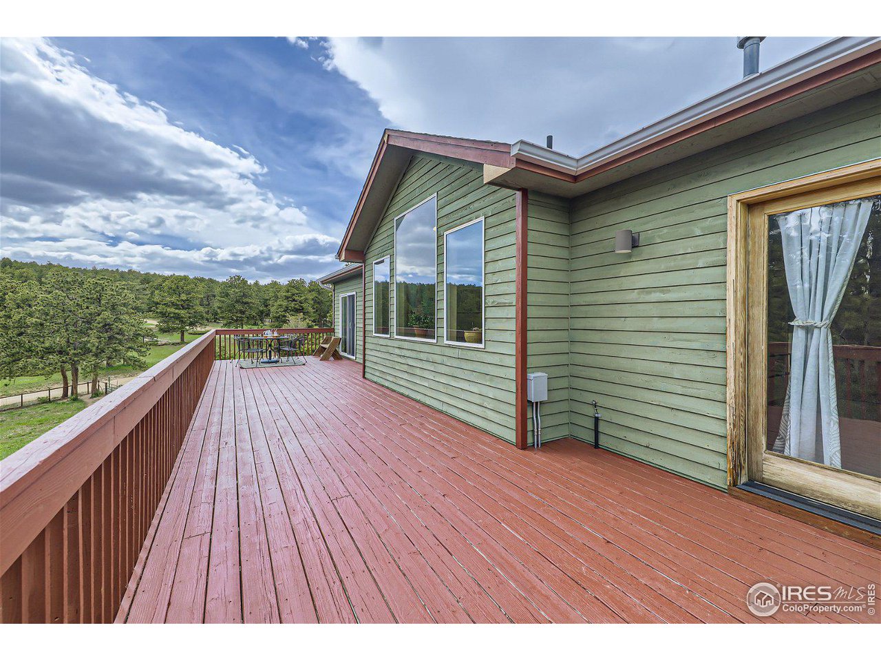 641 Ranch Road Ward, CO 80481 - Photo 25 of 40 a balcony with view of outdoor space