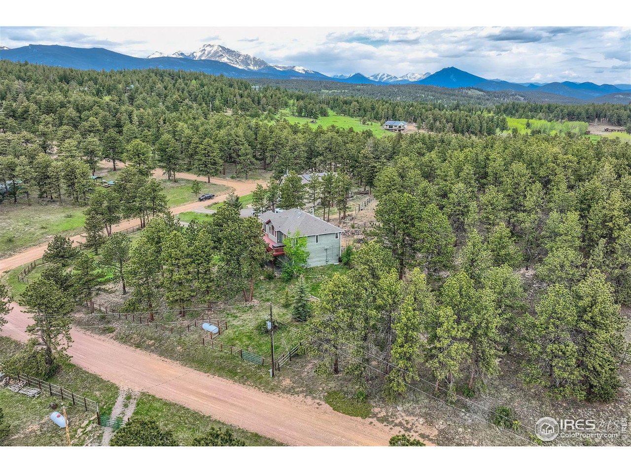 641 Ranch Road Ward, CO 80481 - Photo 4 of 40 a view of a lush green hillside and houses