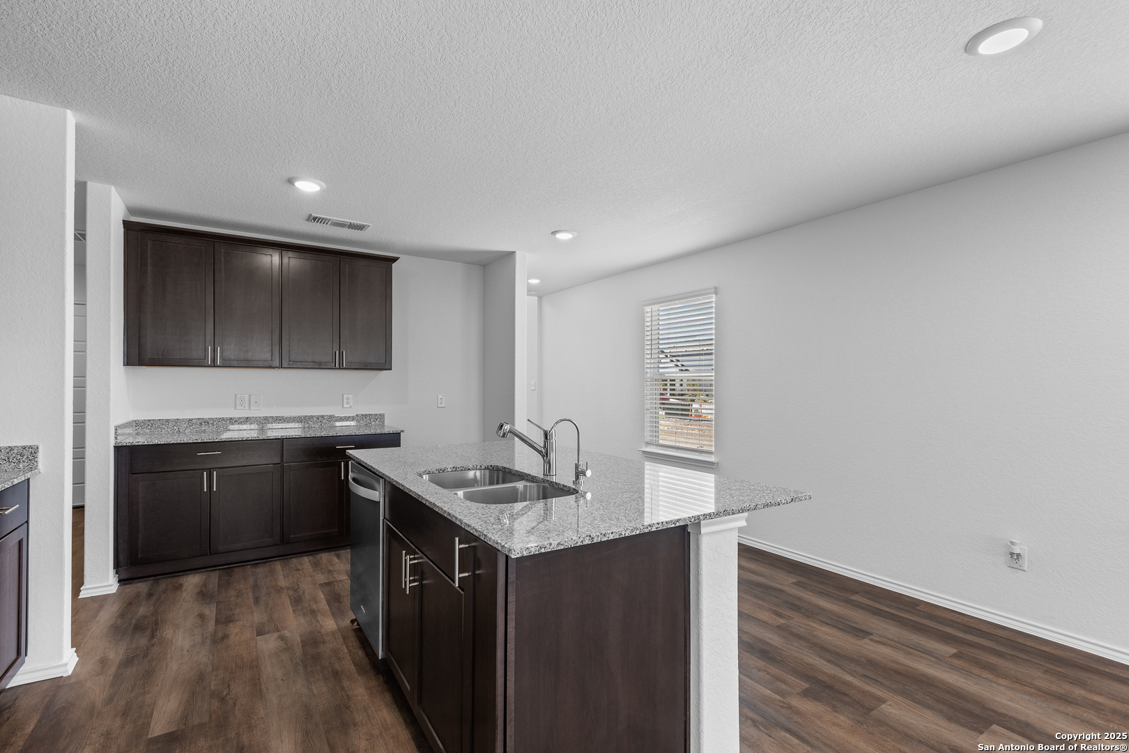 416 Raven Row Marion, TX 78124 - Photo 5 of 29 a kitchen with stainless steel appliances granite countertop a sink stove and refrigerator