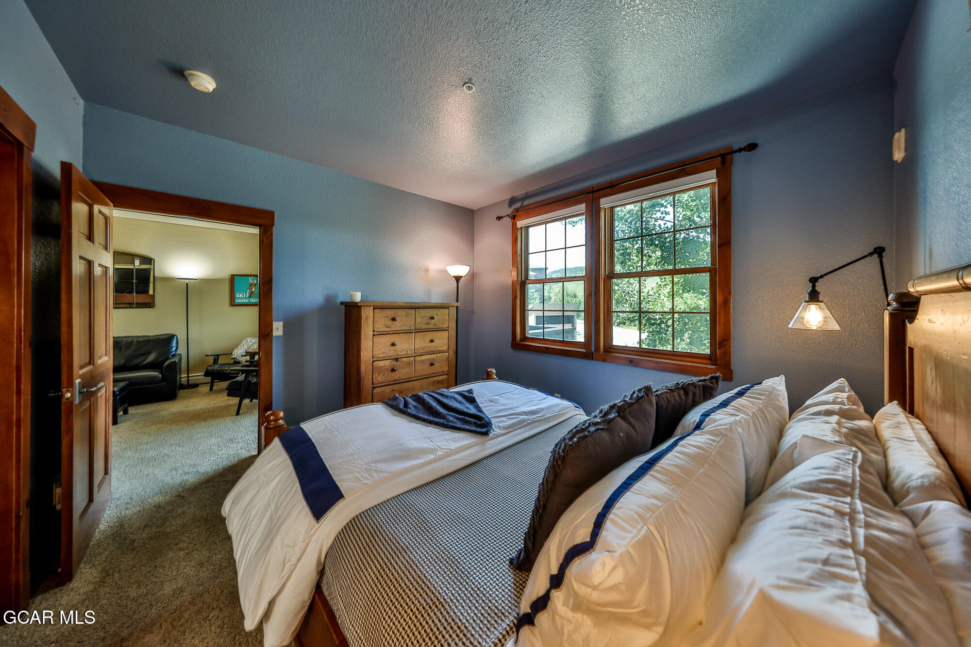 5202 Northstar, Unit 5202 Granby, CO 80446 - Photo 20 of 42 a bedroom with a bed and wooden floor