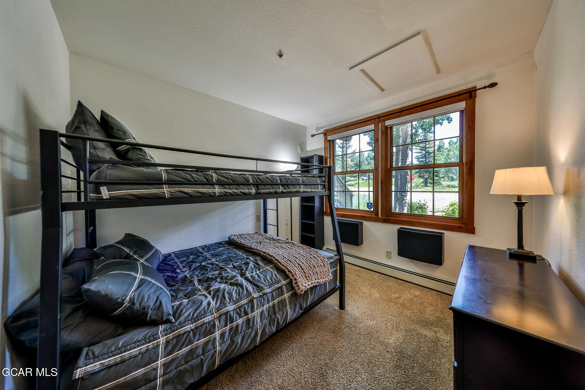 5202 Northstar, Unit 5202 Granby, CO 80446 - Photo 22 of 42 a bedroom with a bed window and a desk