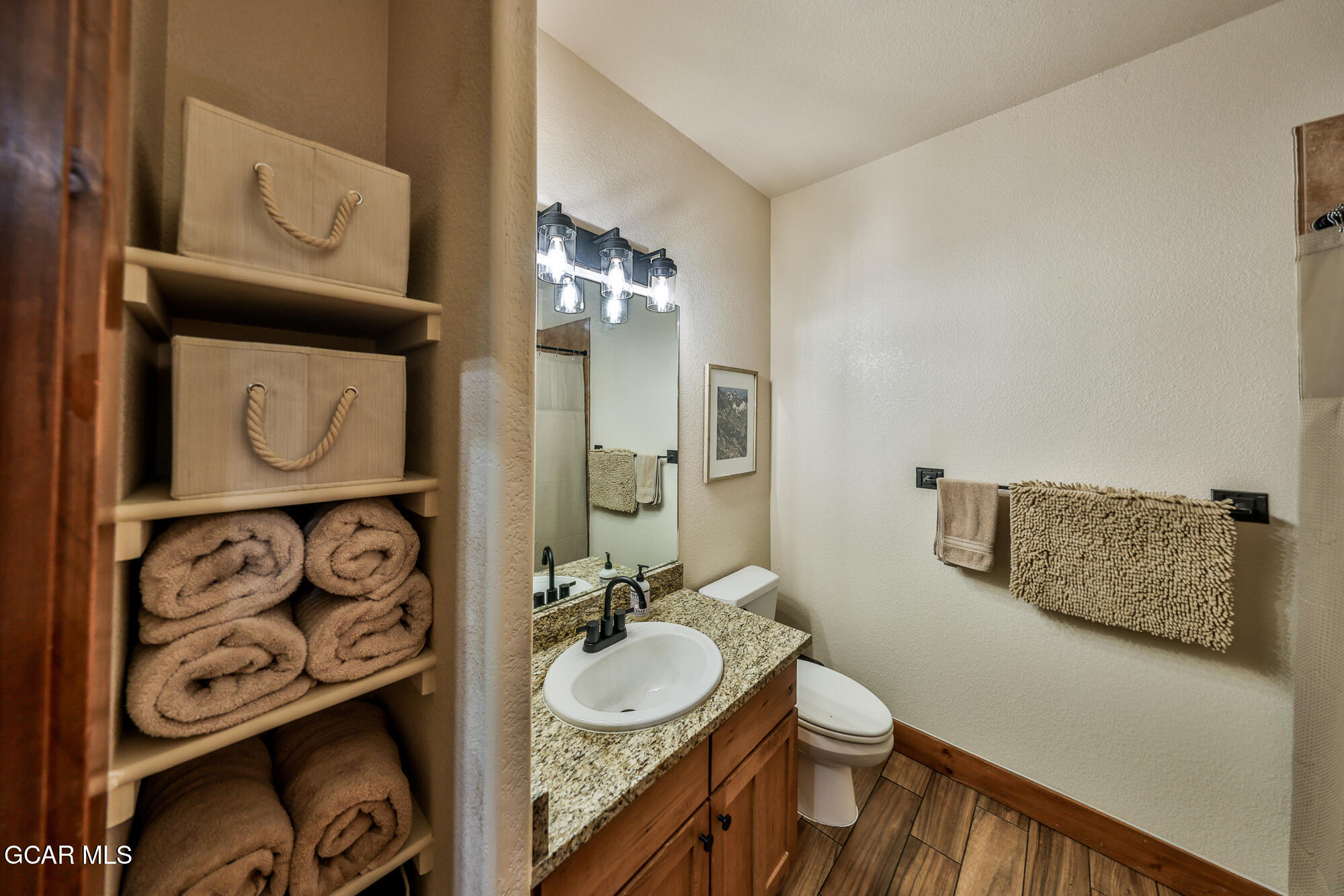 5202 Northstar, Unit 5202 Granby, CO 80446 - Photo 24 of 42 a bathroom with a sink a toilet and mirror
