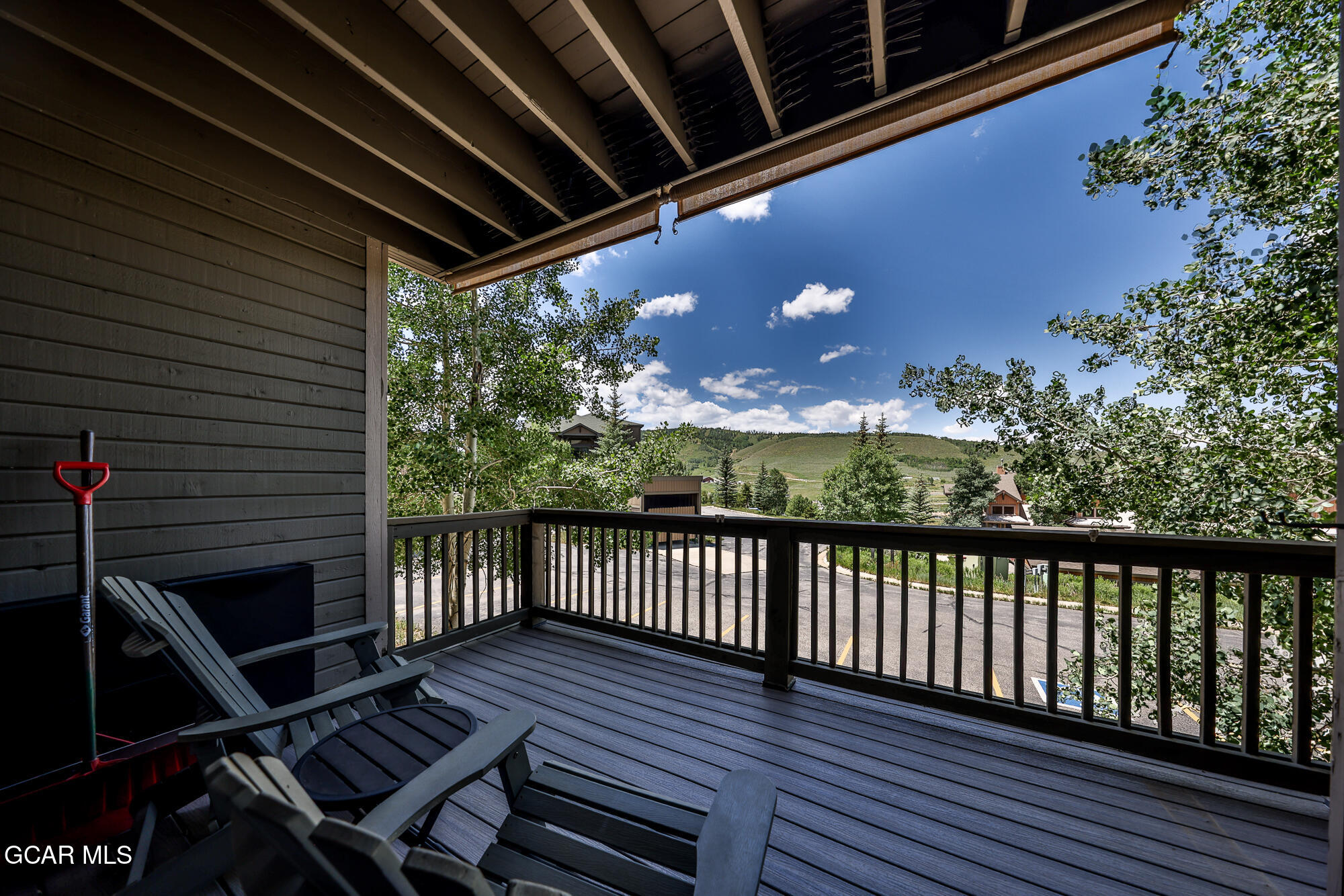 5202 Northstar, Unit 5202 Granby, CO 80446 - Photo 25 of 42 a view of balcony with wooden floor and outdoor seating