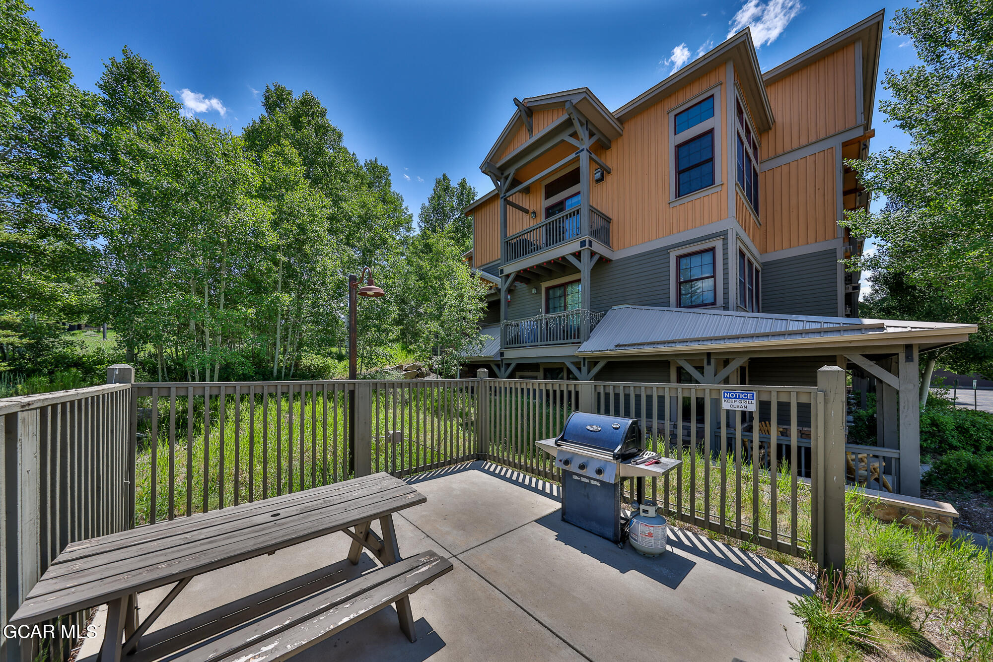 5202 Northstar, Unit 5202 Granby, CO 80446 - Photo 29 of 42 a view of a chair and tables on the deck