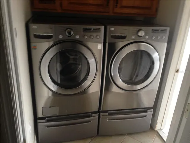 a utility room with dryer and washer