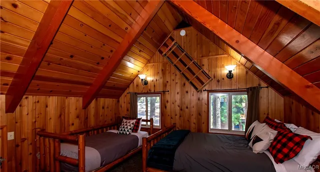 a view of a two chairs in the balcony