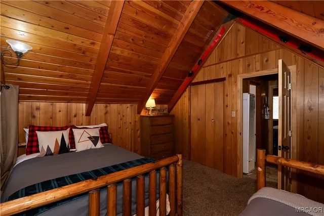 a bedroom with a bed and dresser