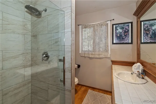 a bed sitting in a room next to a window